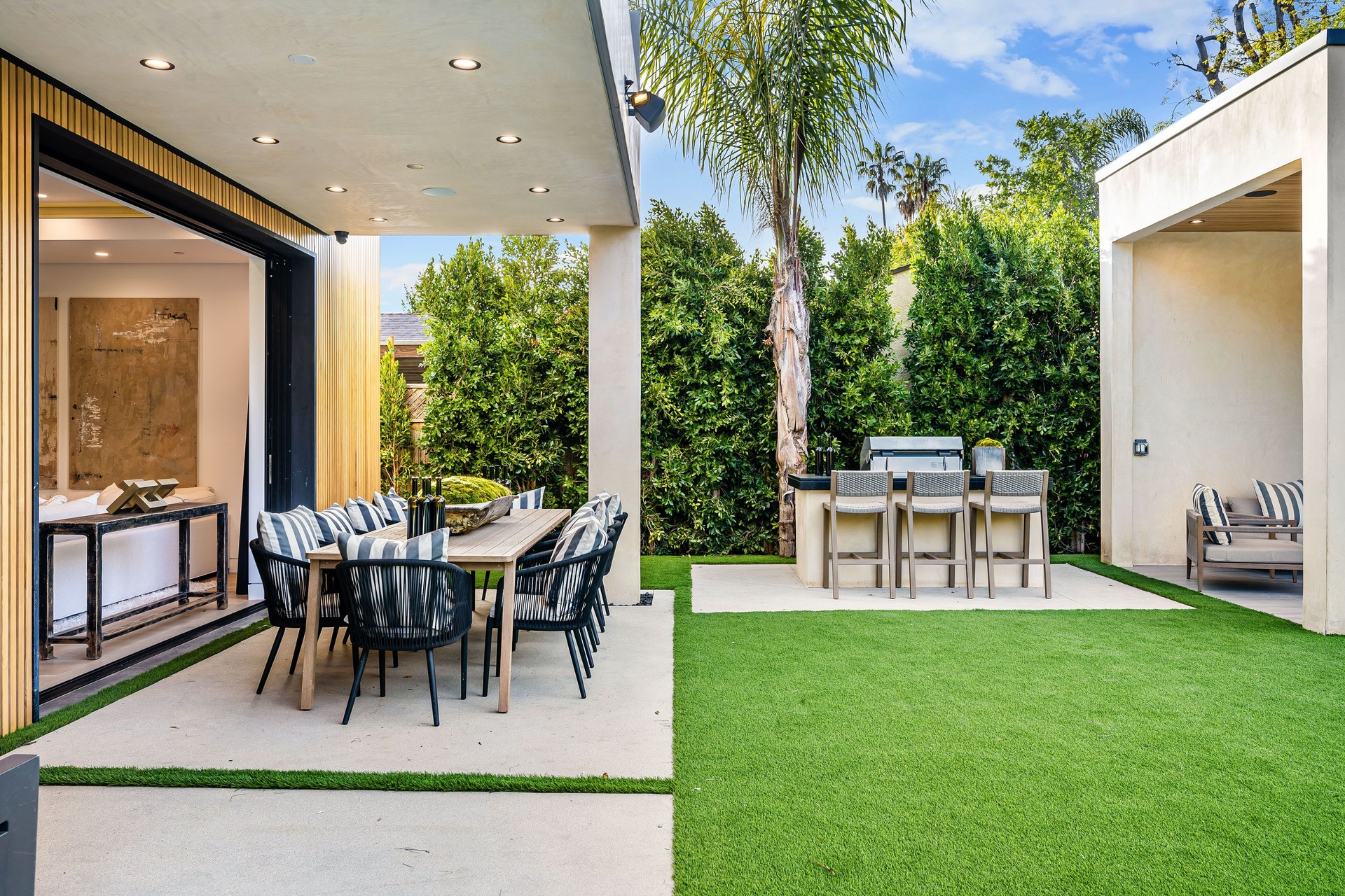 Modern outdoor dining area with barbecue grill